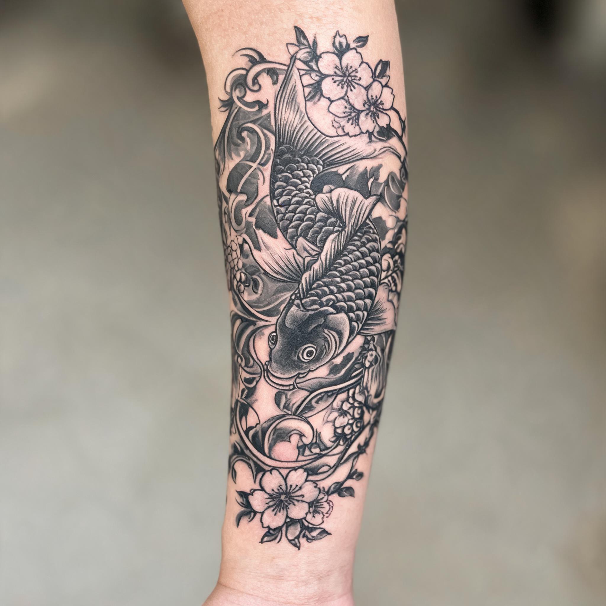 Black and grey Ed Hardy style tattoo image of a tiger and rose tattooed on a person's inner forearm against a neutral background.