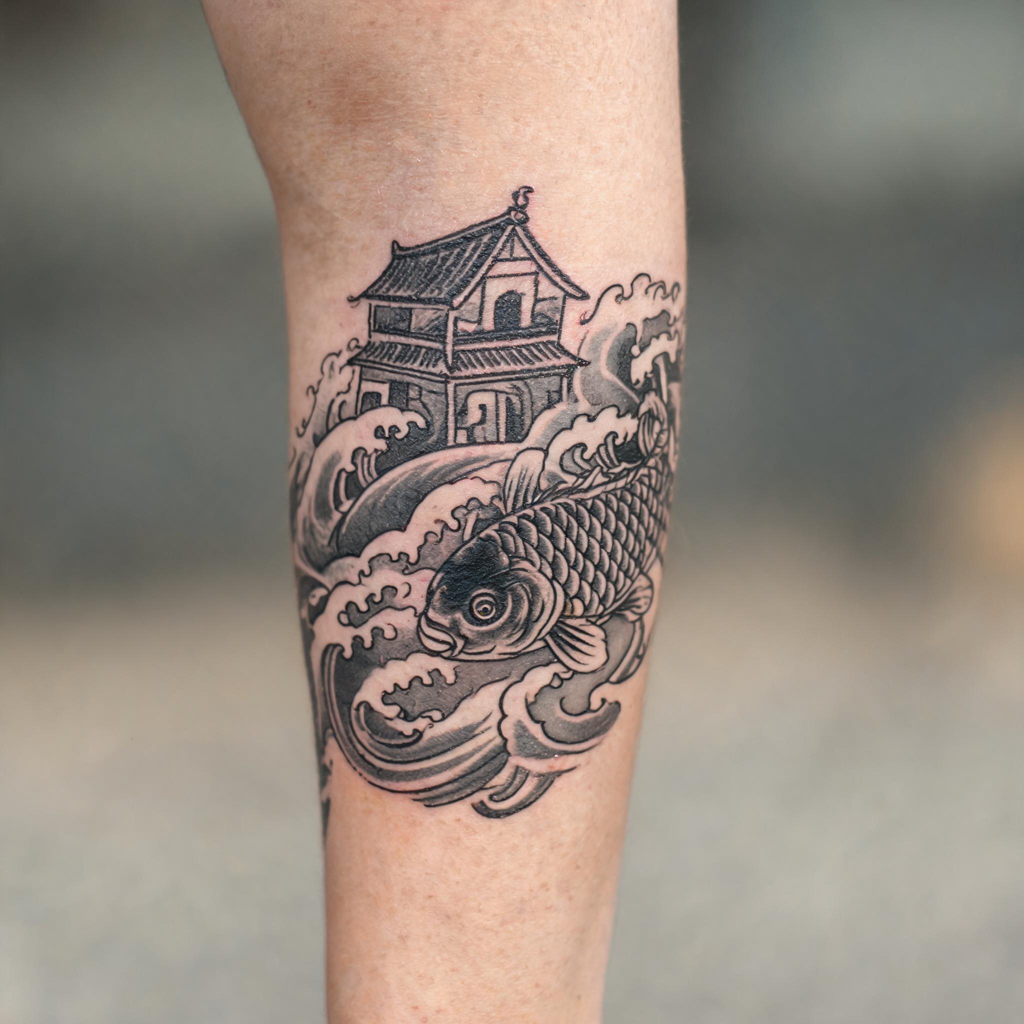 A black and grey Japanese irezumi haunted house tattoo on the outer forearm, shown on skin against a clean neutral background.