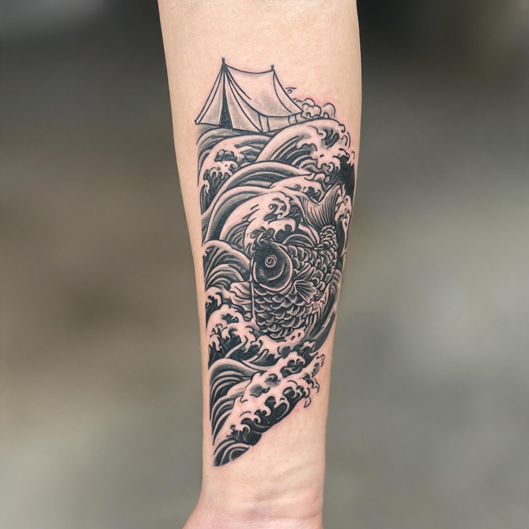 Black and grey Japanese irezumi tattoo of a camping tent with koi and waves on an inner forearm, shown on a neutral background.